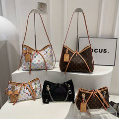 Sac à bandoulière à monogramme à lanières croisées