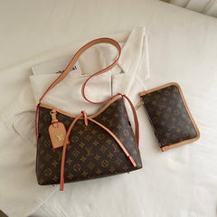 Sac à bandoulière à monogramme à lanières croisées
