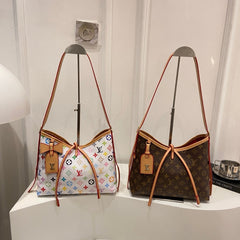 Sac à bandoulière à monogramme à lanières croisées