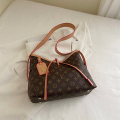 Sac à bandoulière à monogramme à lanières croisées